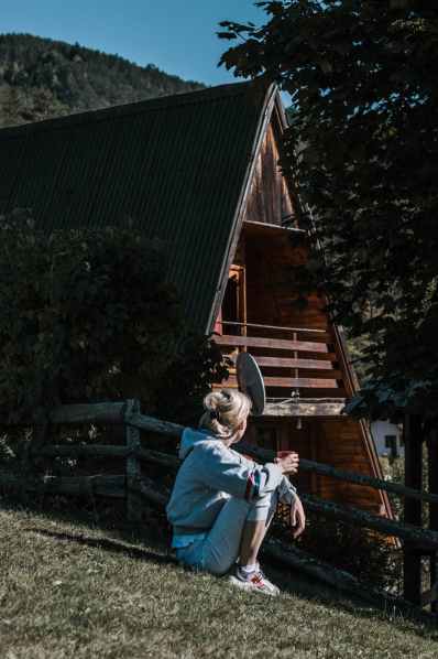 woman having coffee drink outside the house